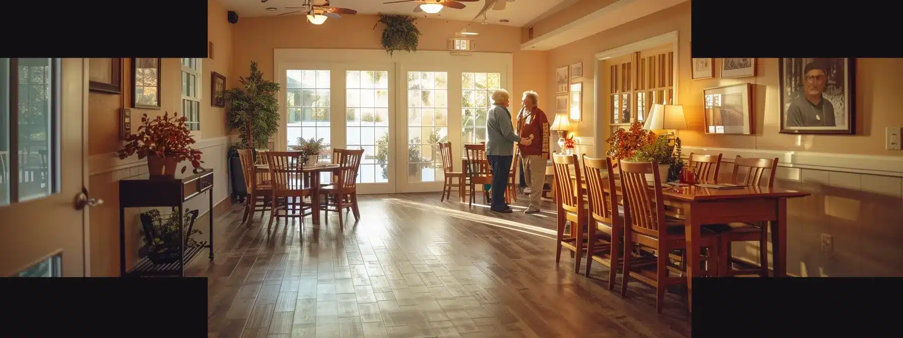 a warmly-lit, inviting dementia care home interior shows a caregiver attentively interacting with an elderly resident, surrounded by personalized care plans and family photos, emphasizing the importance of tailored support and compassionate connection in enhancing well-being.