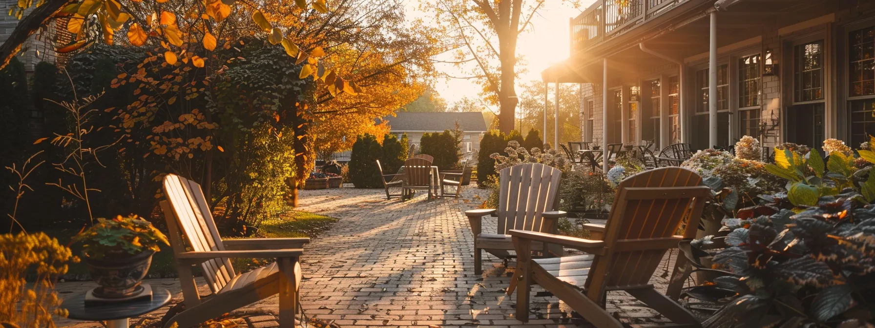 a serene and inviting assisted living facility, showcasing an elegantly landscaped garden where older adults engage in leisurely activities, bathed in warm afternoon light, evoking a sense of community and comfort.